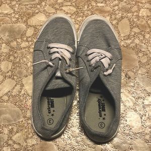 Shoes are gray and have never been worn have a little stain in left shoes lace.